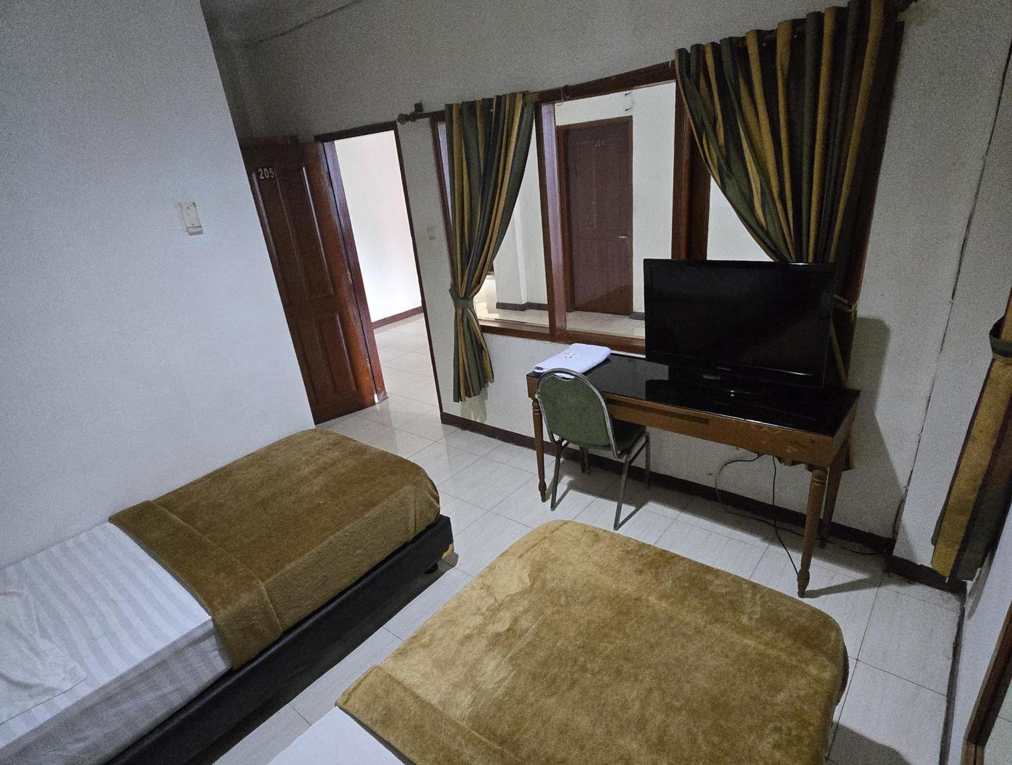 Hotel Maxim Kwitang Джакарта Номер фото